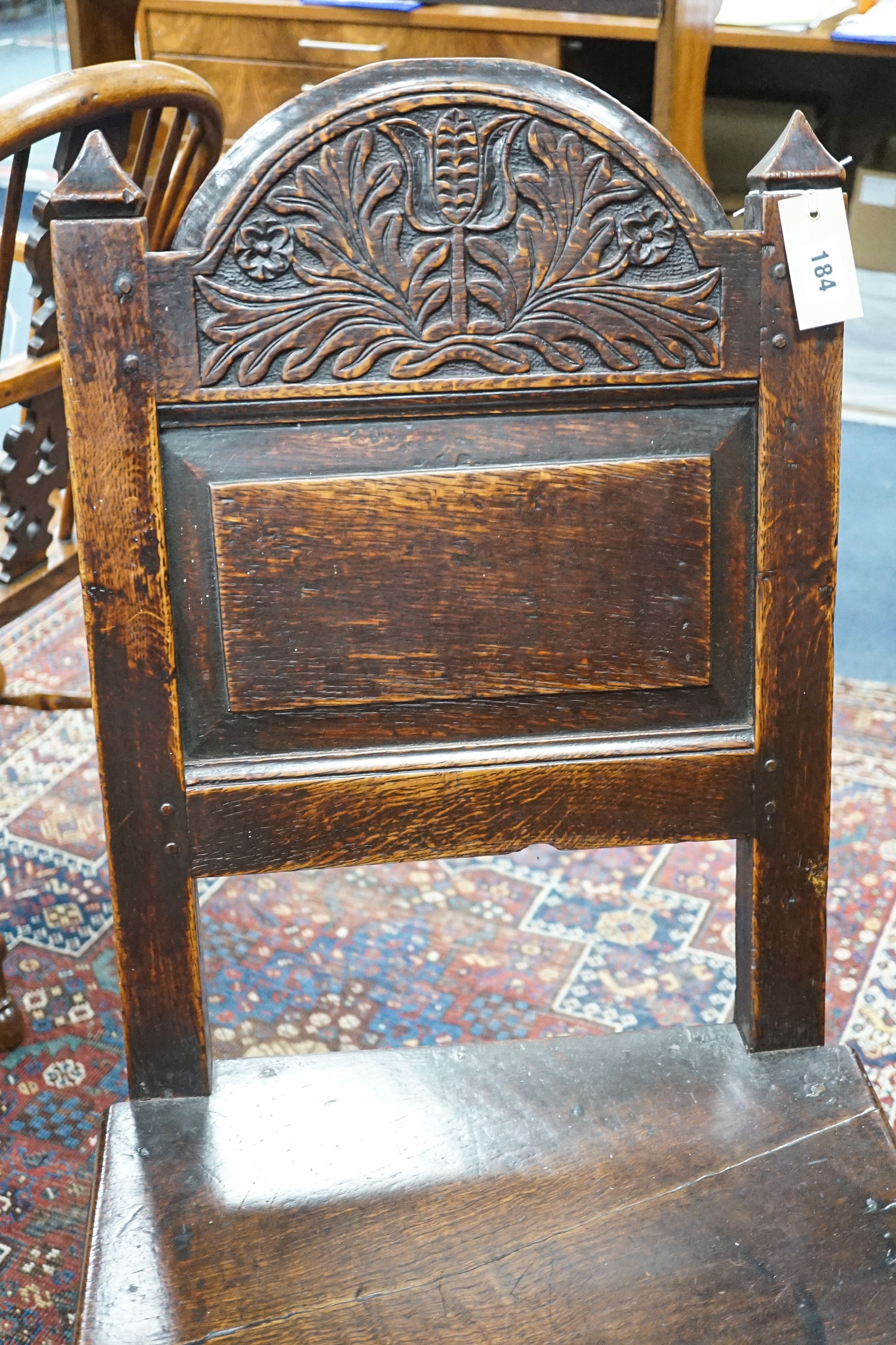 A 17th century Lancashire carved oak side chair, width 47cm, depth 36cm, height 104cm